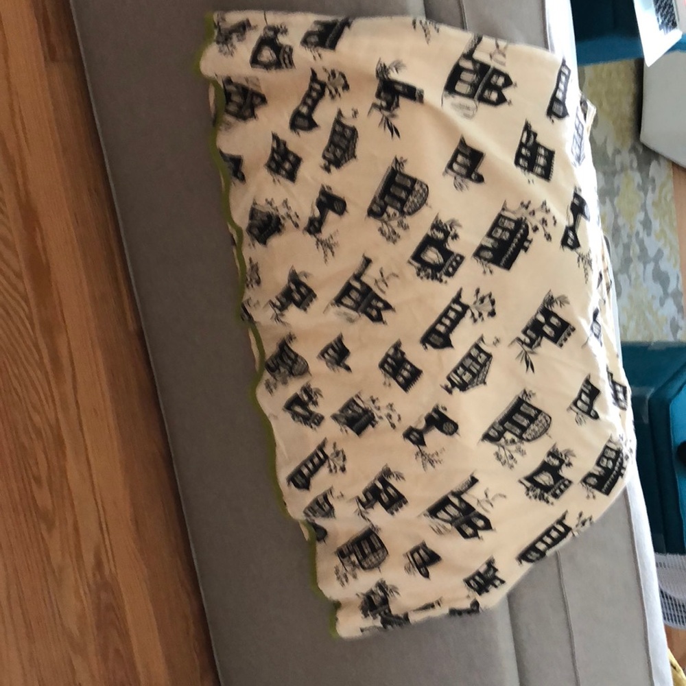 Cream skirt  black pattern and green detail